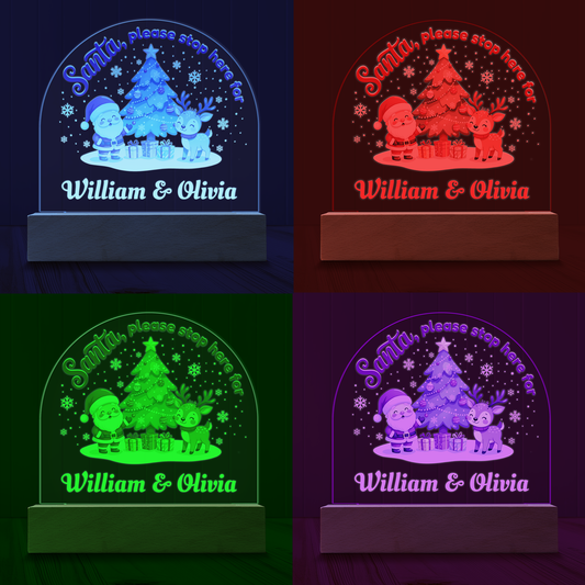 Color-changing night light with Santa, reindeer, and Christmas tree design, personalized with children's names.