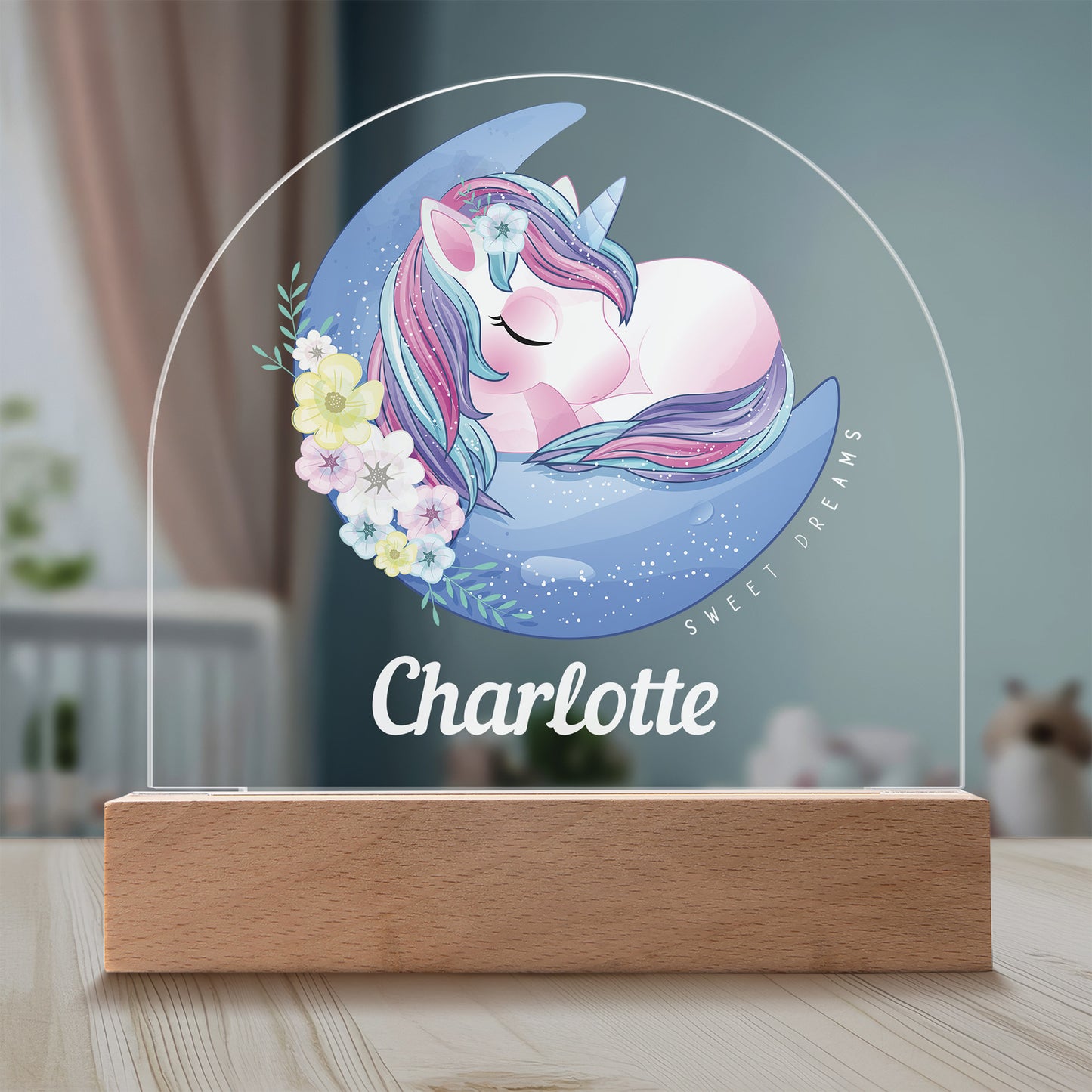 Sweet Dreams Unicorn Personalized Night Light featured on a light timber table in a cosy child's bedroom.