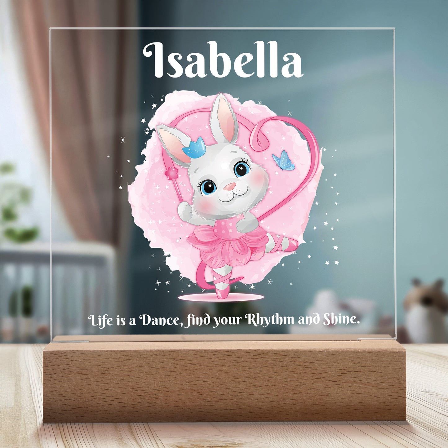 Dancing Bunny Personalized Night Light with Battery powered base featured on a light timber table in a cosy child's bedroom.