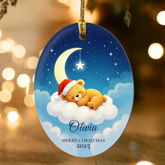 Personalized Christmas ornament with a teddy bear wearing a Santa hat on a cloud, surrounded by stars and a moon against a festive background.