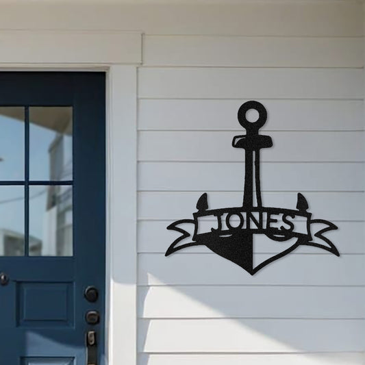 Closeup of Fancy Anchor Banner Metal Decor personalized with the family name and displayed on the front porch of a seaside home.