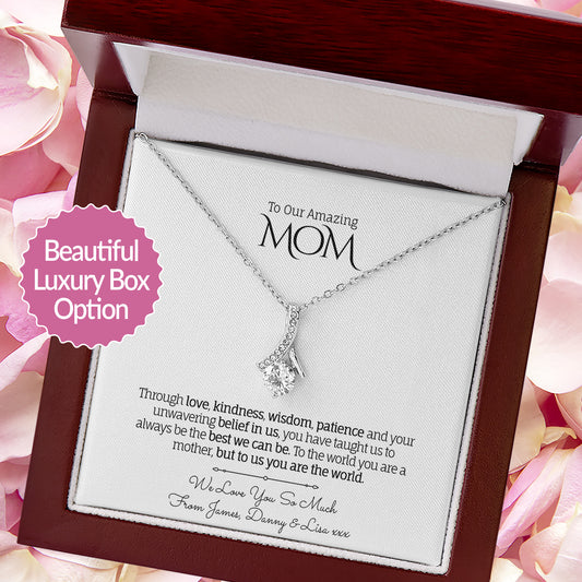 Necklace in a decorative box with a message for 'Mom' surrounded by pink flowers.
