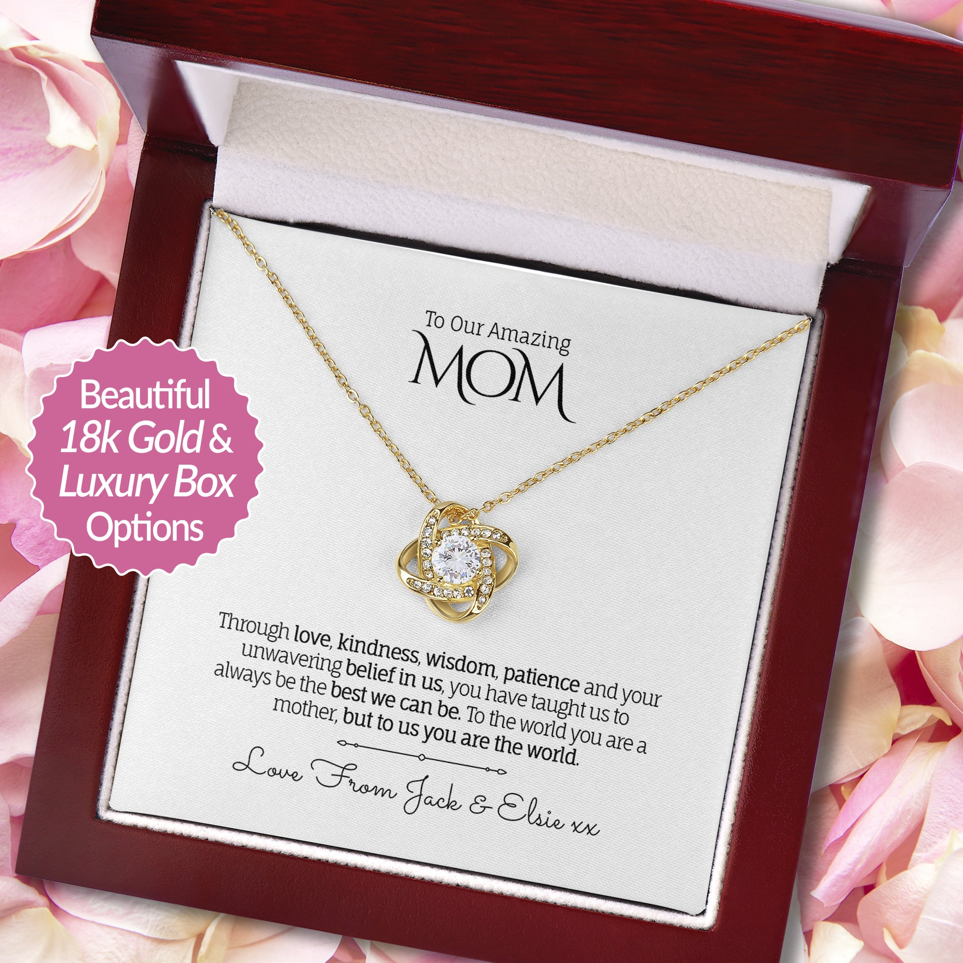 Beautiful Love Knot necklace in 18k Gold finish with a round-cut cubic zirconia in the center, presented in a luxury mahogany-style gift box with a personalized message card to Mom, on a background of soft pink rose petals.