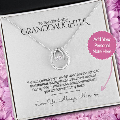 Lucky in Love Pendant Necklace with a sentimental message card for Granddaughter in a Soft Touch Box on a floral background.