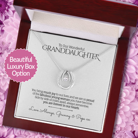 Lucky in Love Pendant Necklace with a sentimental message card for Granddaughter in a Luxury Box on a floral background.