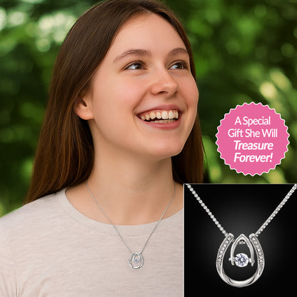 Young girl wearing 14k White Gold Finish Lucky in Love necklace with greenery in the background.