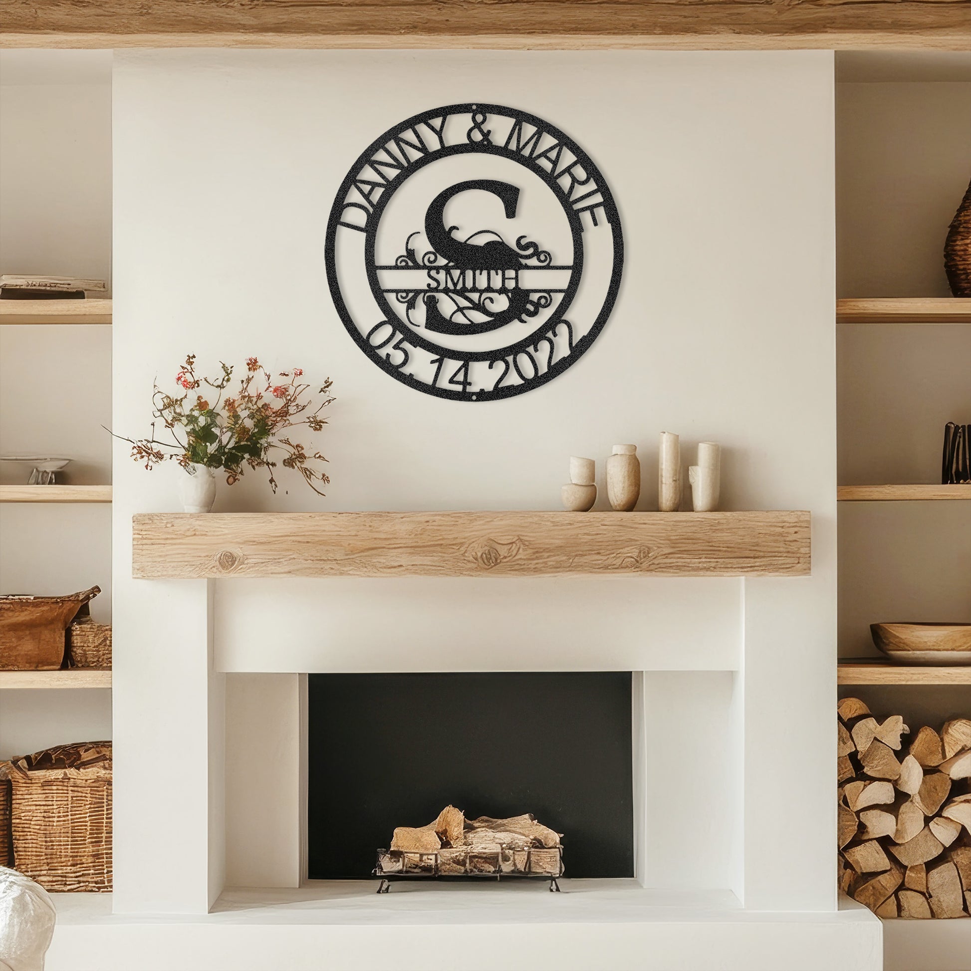 Black Fanciful Monogram Personalized Metal Decor mounted above a modern fireplace.