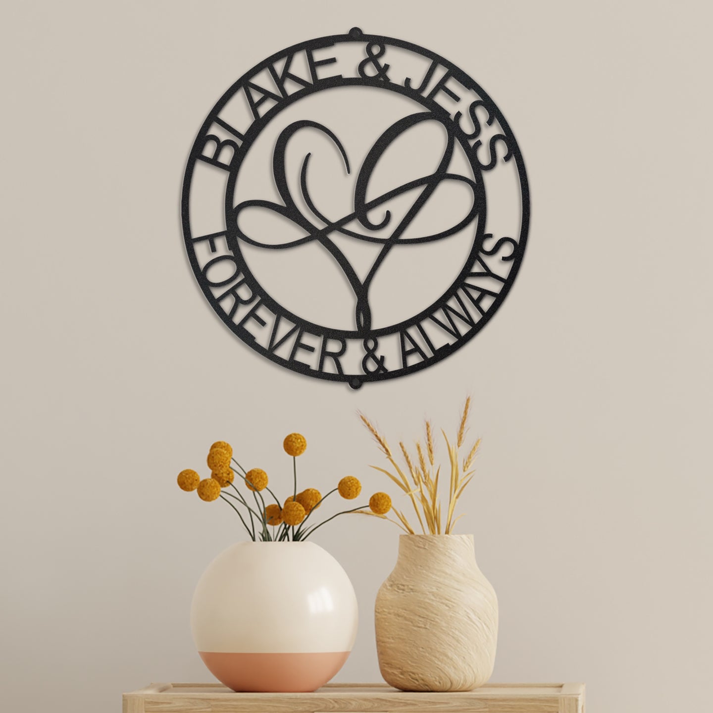 Infinite Love Personalized Metal Decor piece displayed in Black on the wall of a modern home and personalized with a couples names and the phrase 'Forever & Always'.