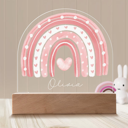 Boho Rainbow Personalized Night Light with Battery powered base featured on a light timber table with a neutral beige panelled wall and bunny and rainbow ornaments in the background.