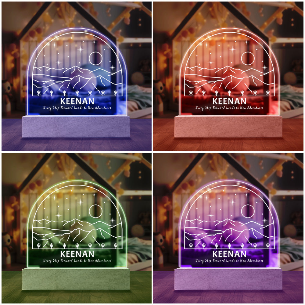 New Adventures Personalized Night Light shown with four of the seven available colored LED lights on in Blue, Red, Purple and Green.