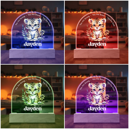 Adorable Tiger Cub Personalized Night Light shown with four of the seven available colored LED lights on in Blue, Red, Purple and Green.