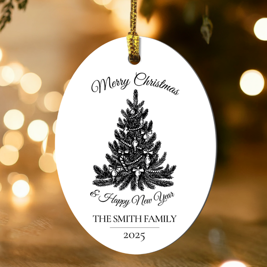 Decorative Christmas ornament with tree design and text, hanging against a festive background with lights.