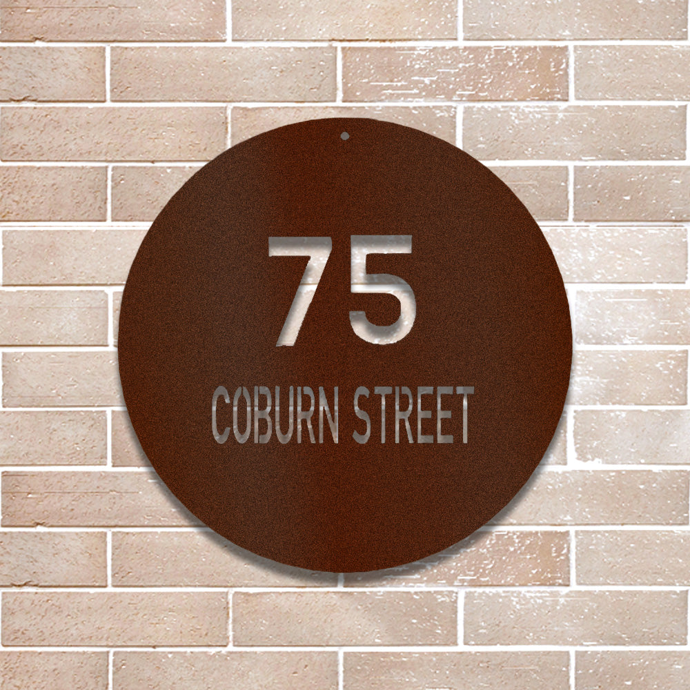 Copper Contemporary Circle Address Metal Sign mounted on a modern brick wall