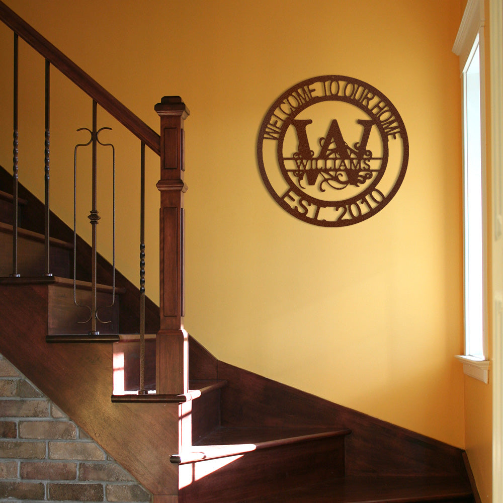 Copper Fanciful Monogram Personalized Metal Decor featured on a bright yellow wall over a staircase in a traditional home