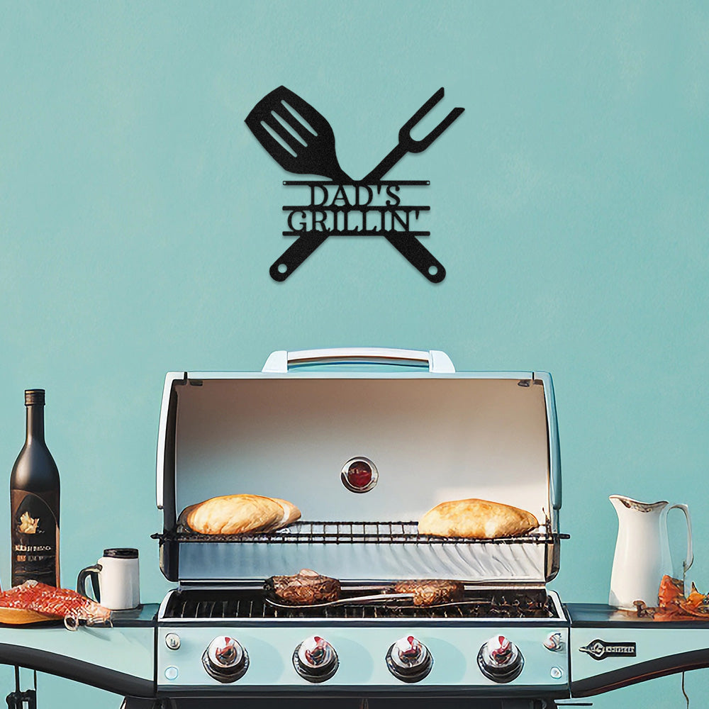 Black BBQ Grill Utensils Personalized Metal Decor featured on a light blue wall above a sleek stainless steel BBQ Grill