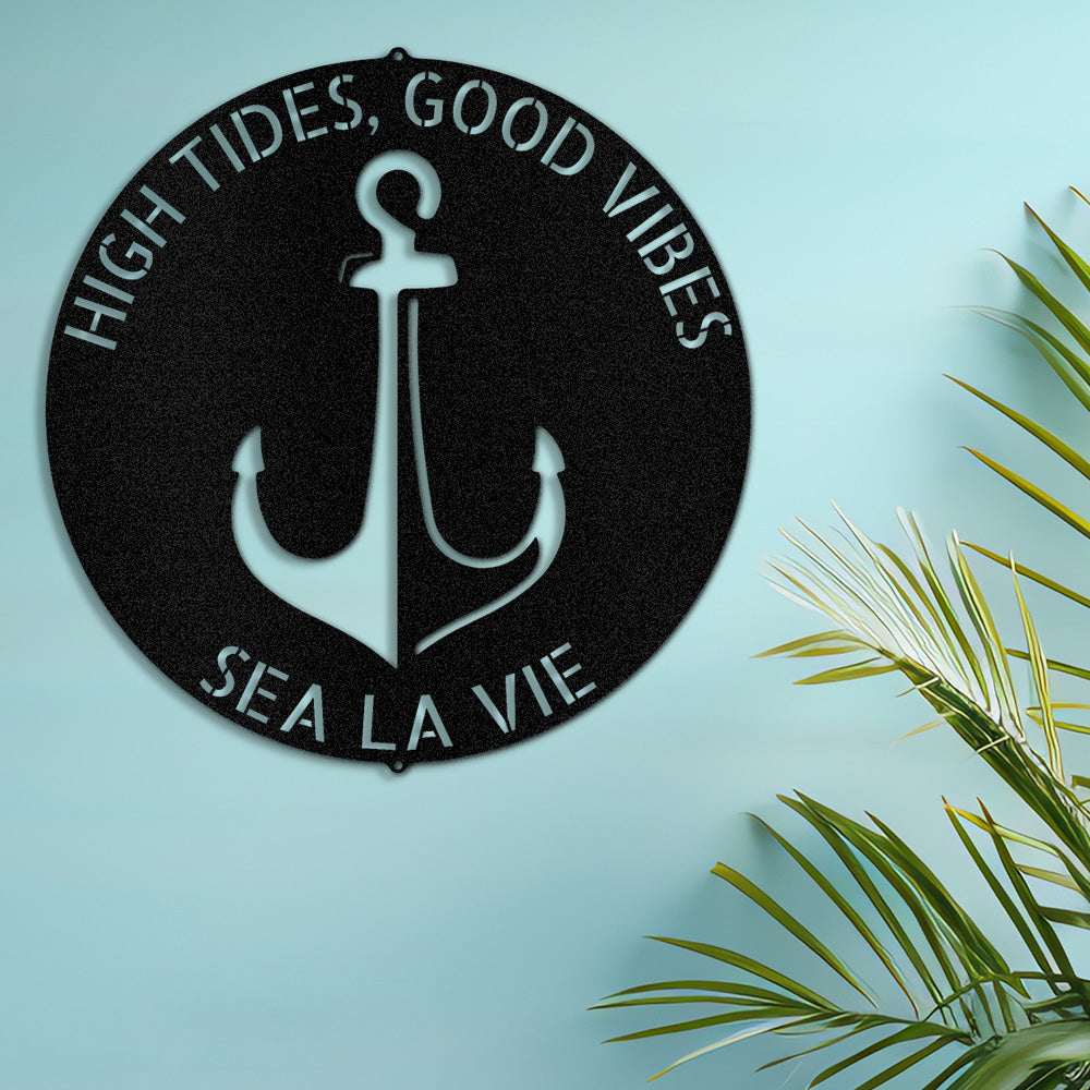 Bold Anchor Plaque Personalize Metal Decor customized with fun nautical phrases and displayed in Black on a soft blue colored wall in a modern home.