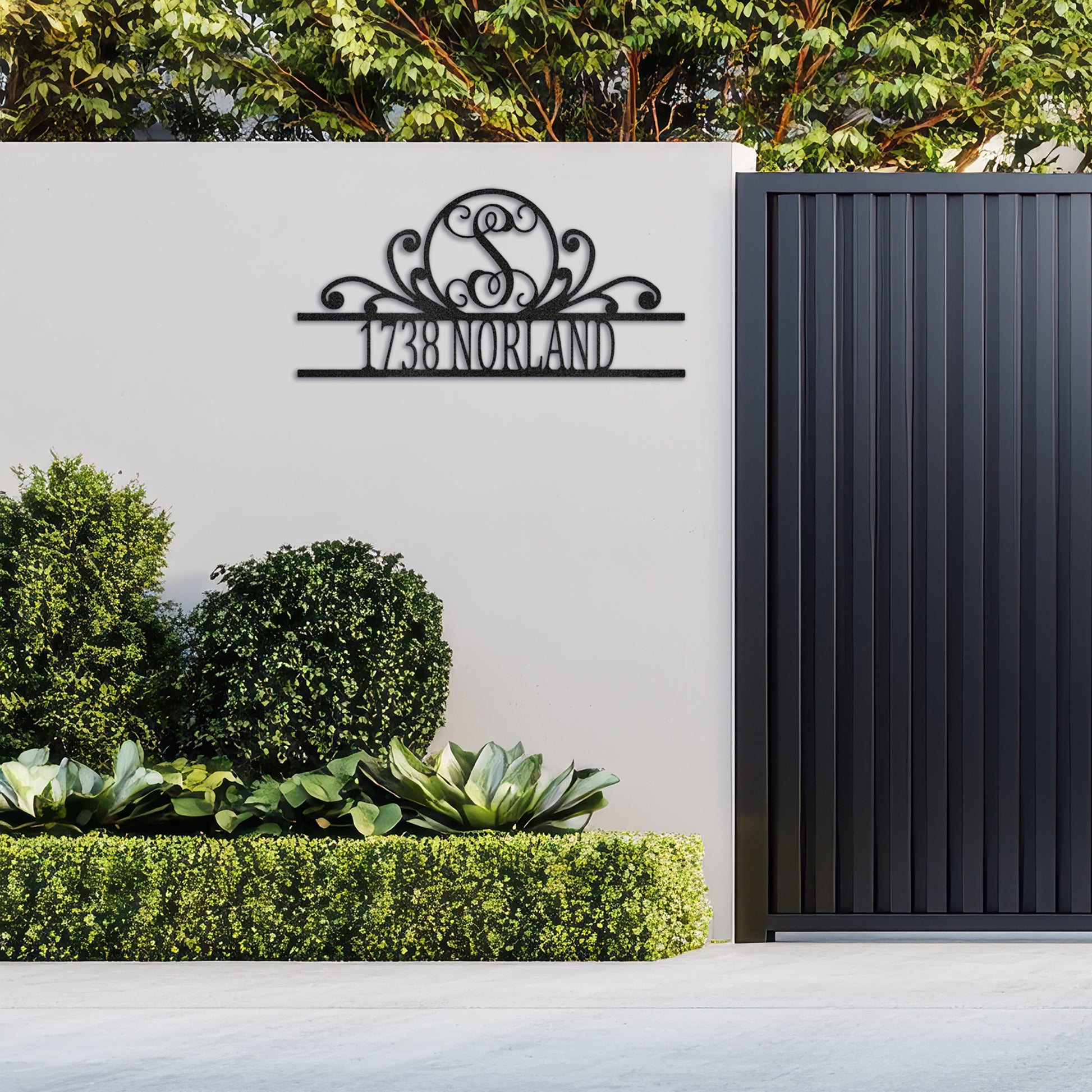 Fancy Scroll Monogram Metal Decor customized with an address and fixed to the external wall of a home.