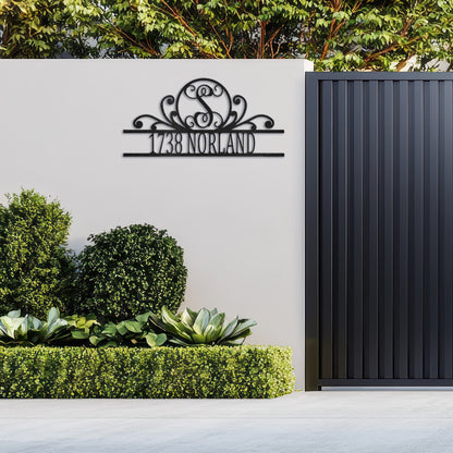 Fancy Scroll Monogram Metal Decor customized with an address and fixed to the external wall of a home.