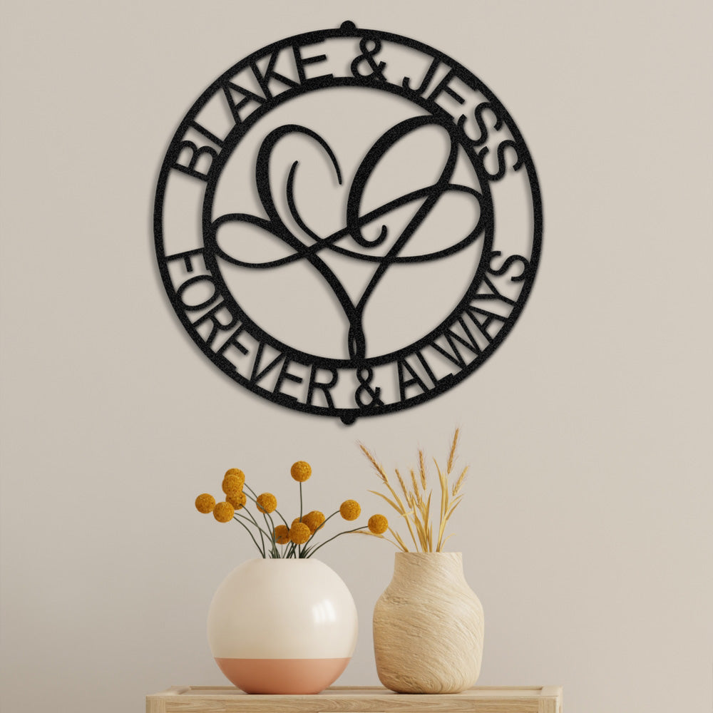 Infinite Love Personalized Metal Decor piece displayed in Black on the wall of a modern home and personalized with a couples names and the phrase 'Forever & Always'.