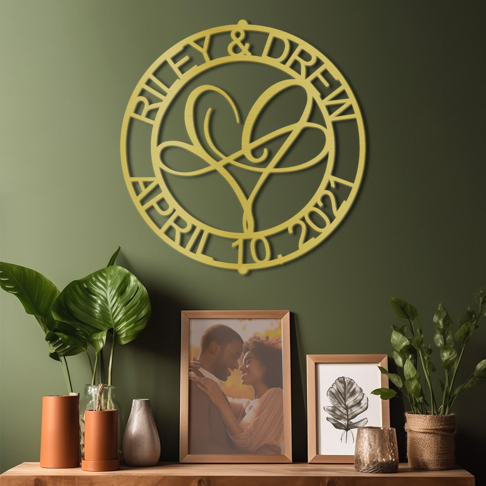 Infinite Love Personalized Metal Decor piece displayed in Gold on a dark green wall of a modern home and personalized with a couples names and a special date.