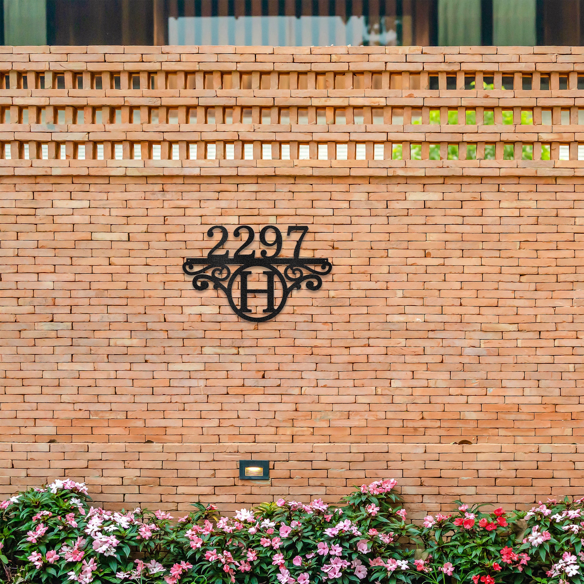 Sophisticated Monogram Number Metal Address Sign in Black, mounted on the street front of a brick wall.